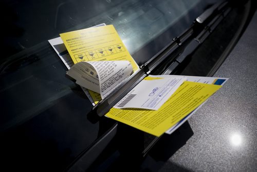 ZACHARY PRONG / WINNIPEG FREE PRESS  A parking ticket on the windshield of a car parked on Market Ave. August 8, 2016.