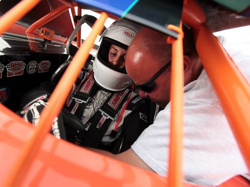 PHIL HOSSACK / WINNIPEG FREE PRESS - Victoria Stutsky gets a once over from father Rob before some hot laps at Red River Speedway turn Monday evning. See Dave Sanderson story.  See story. August 8, 2016