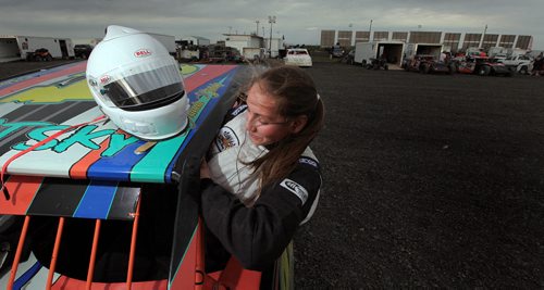 PHIL HOSSACK / WINNIPEG FREE PRESS - Victoria Stutsky slides into the cockpit of her race car at Red River Speedway turn Monday evning. See Dave Sanderson story.  See story. August 8, 2016