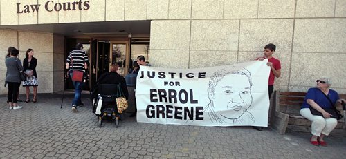 PHIL HOSSACK / WINNIPEG FREE PRESS -  Protestors starting a 24hr vigil unfurl a banner in support of Errol Greene at the Law Courts in front of the remand centre where he died in May. See story. August 8, 2016