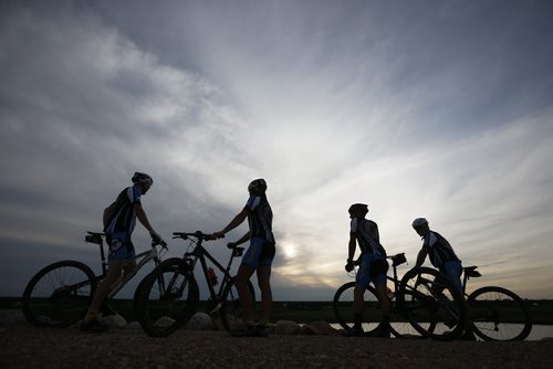 JOHN WOODS / WINNIPEG FREE PRESS Manitoba Cycling mountain bike team coaches watch as their team practices at Bison Butte, a new racing venue in Winnipeg, Tuesday, August 9, 2016.