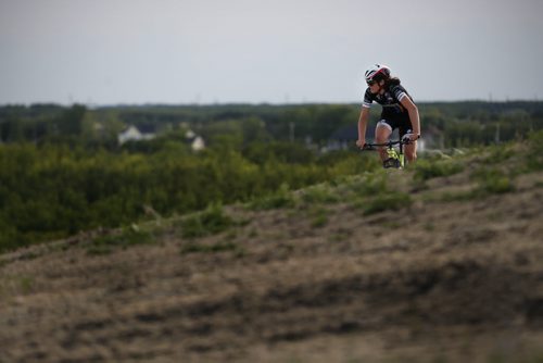 JOHN WOODS / WINNIPEG FREE PRESS Mitch Ketler of the Manitoba Cycling mountain bike team makes his way up a hill as he practices at Bison Butte, a new racing venue in Winnipeg, Tuesday, August 9, 2016.