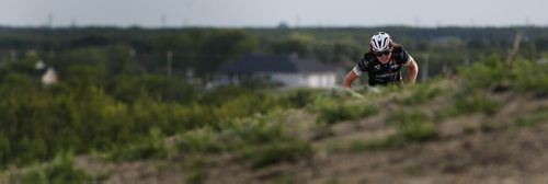 JOHN WOODS / WINNIPEG FREE PRESS Mitch Ketler of the Manitoba Cycling mountain bike team makes his way up a hill as he practices at Bison Butte, a new racing venue in Winnipeg, Tuesday, August 9, 2016.