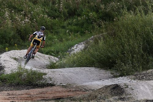 JOHN WOODS / WINNIPEG FREE PRESS A member of Manitoba Cycling mountain bike team practices at Bison Butte, a new racing venue in Winnipeg, Tuesday, August 9, 2016.