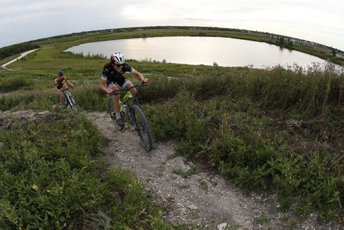 JOHN WOODS / WINNIPEG FREE PRESS Mitch Ketler (R) and Carson Thompson of the Manitoba Cycling mountain bike team make their way up a hill as the team practices at Bison Butte, a new racing venue in Winnipeg, Tuesday, August 9, 2016.