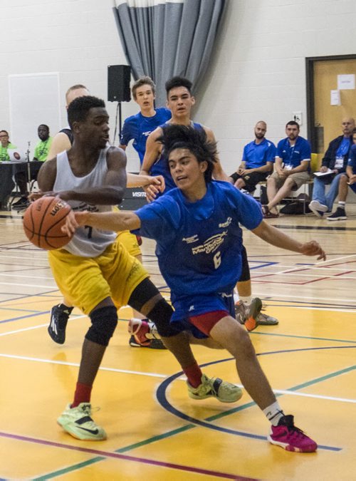 ZACHARY PRONG / WINNIPEG FREE PRESS  Jalen Millan, number 6, of the Winnipeg Blue steals the ball from Fabrice Kazadi of the Winnipeg Gold during the Manitoba Summer Games Male Basketball final on August 10, 2016. The Winnipeg Gold eventually came out on top with a 82-75 win.