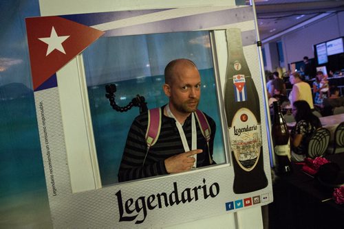 MIKE DEAL / WINNIPEG FREE PRESS Ben MacPhee-Sigurdson takes us on a tour of Folklorama pavilion's to sample various drinks and food. The Cuban Pavilion and their Legendario photo booth. 160809 - Tuesday, August 09, 2016