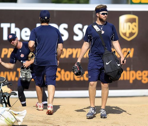 PHIL HOSSACK / WINNIPEG FREE PRESS - Goldeye southpaw pitcher Ethan Carnes (right) heads back to the club room from the practice mound Thursday afternoon after batting practice. See Mike McIntyre's story.   August 11, 2016