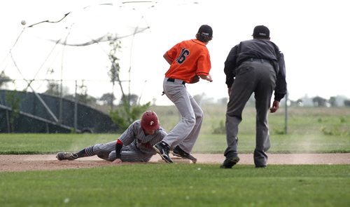 RUTH BONNEVILLE / WINNIPEG FREE PRESS  Elmwood's #61 Austin Smith manages to steal 2nd base from South Winnipeg's 2nd  baseman #16 Owen Rohl  during Game 4 of MJBL final series at Charleswood Park Thursday evening,    Aug 11, 2016