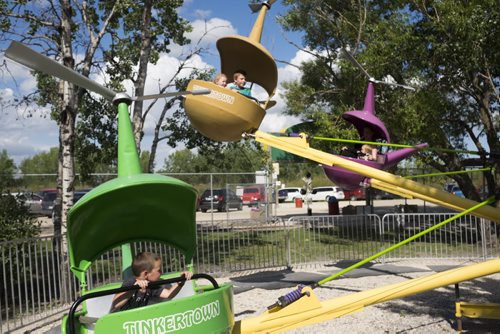 ZACHARY PRONG / WINNIPEG FREE PRESS  Children go for a ride on the "helicopter". August 11, 2016.