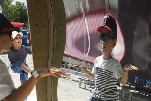 ZACHARY PRONG / WINNIPEG FREE PRESS  Jhase Farzyna, left, and Alex Beaufort-Bell look into a carnival mirror. August 11, 2016.