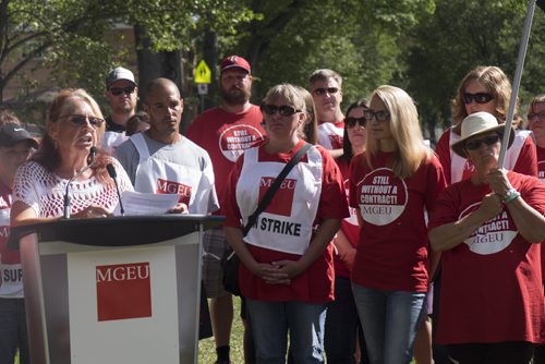 ZACHARY PRONG / WINNIPEG FREE PRESS  Michelle Gawronsky, left, the president of the Manitoba Government and General Employees Union (MGEU) surrounded by Macdonald Youth Services (MYS) Crisis Stabilization members and supporters during a rally on August 12, 2016. The MYS Crisis Stabilization members have been on strike for 11 days after more than two years of negotiations over salaries failed.