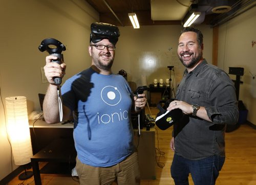 WAYNE GLOWACKI / WINNIPEG FREE PRESS     At left, Daniel Blair, CEO, BITSPACE Development, a member company at North Forge in the human computer interaction lab with Jeff Ryzner, CEO of  North Forge.  Martin Cash story August 12 2016