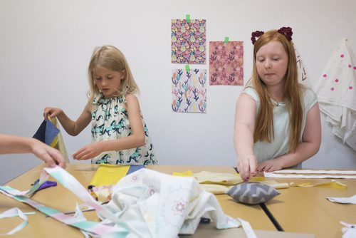 ZACHARY PRONG / WINNIPEG FREE PRESS  Sadie, 8, (from left) and Lauren, 12, work on their tote bags at the Sew Fun Studio. August 12, 2016.