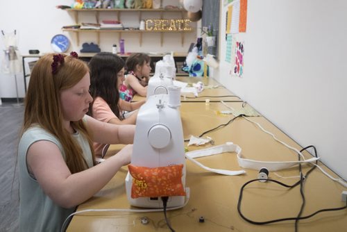 ZACHARY PRONG / WINNIPEG FREE PRESS  Kids putting final touches on their tote bags at the Sew Fun Studio. Throughout the course they learn a variety of skills such as operating a sewing machine. From left, Lauren, 12, Emma, 11 and Abby, 12. August 12, 2016.