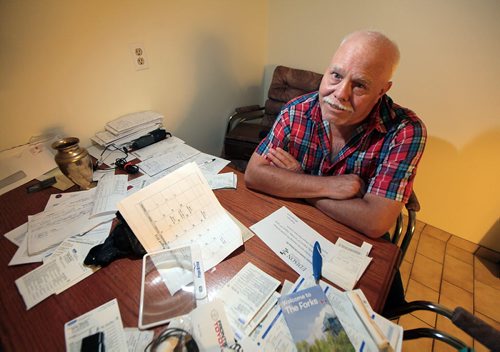 PHIL HOSSACK / WINNIPEG FREE PRESS -  Dennis Guile 67, and retired because of a brain injury sustained while driving long haul 16 years ago. He has struggled ever since, with memory, with emotions and relationships. Sitting at his kitchen table which is covered with notes to remind him of what he needs to do. See Joel Schlesinger story.  August 12, 2016