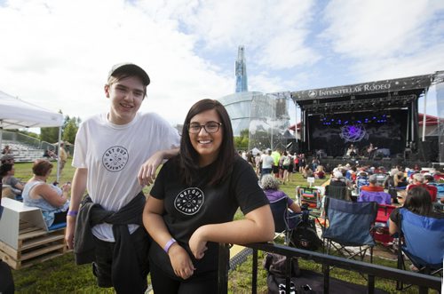 RUTH BONNEVILLE  / WINNIPEG FREE PRESS  ENT - Interstellar/GOOTB Team members from the Get Out Of the Basement program Jillian Long and Aidan Towers wait for some of the main acts to play at Intersellar Rodeo Friday evening.   See Erin Lebar story.   Aug 12 / 2016