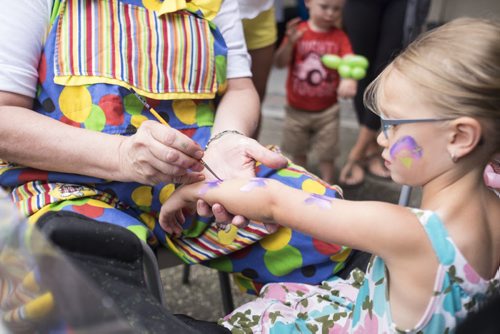 ZACHARY PRONG / WINNIPEG FREE PRESS  Sydney Lewko, 4, has her face and arm painted at the Shelmerdine Local Market. In addition to activities for children, local farmers and artisans will be selling a wide variety of fresh fruits, vegetables, honey, crafts and other products on Saturday and Sunday from 9:00 am - 2:00 pm. August 13, 2016.