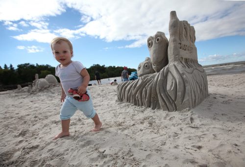 RUTH BONNEVILLE  / WINNIPEG FREE PRESS  (2nd place winner - Dori - Keep Swimming) 19 month-old Scarlet Watson checks out the Dori sandcastle.   Twenty four groups took part in the Grand Beach annual International Sand Castle Competition Saturday raising $2,000.00 for Macdonald Youth Services Mental Health Awareness Education.  Patrick Petrucka has organized the event for the past 5 years but it has been an annual event for over 50 years always taking place on the 2nd Saturday in August.    Standup photos   Aug 13 / 2016