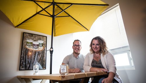 MIKE DEAL / WINNIPEG FREE PRESS Tom Jansen and Amanda Buhse are co-founders of the now-ubiquitous Coal & Canary Candle Co., a local business who has leveraged Instagram in a big way. They just opened a new office/production house on Sanford Street to meet demand. 160810 - Wednesday, August 10, 2016