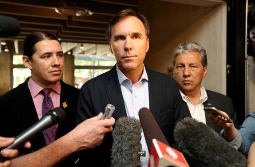 TREVOR HAGAN / WINNIPEG FREE PRESS Canada's Finance Minister, Honourable Bill Morneau, middle, with Robert Falcon Ouellette and Dan Vandal, at Stella's on Provencher, Monday, August 15, 2016.