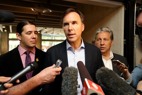 TREVOR HAGAN / WINNIPEG FREE PRESS Canada's Finance Minister, Honourable Bill Morneau, middle, with Robert Falcon Ouellette and Dan Vandal, at Stella's on Provencher, Monday, August 15, 2016.