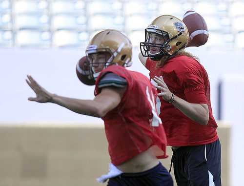 PHIL HOSSACK / WINNIPEG FREE PRESS - Bison quarterback's Theo Deezar (right) and Julian Wytinck wind up looking downfield at Investors Group Field Tuesday afternoon. See Jason Bell story.  August 16, 2016