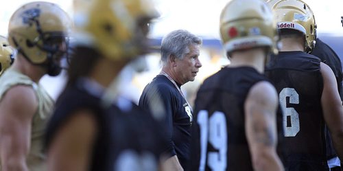 PHIL HOSSACK / WINNIPEG FREE PRESS - Bison head coach Brian Dobie casts a critical eye over the herd as they practice at Investors Group Field Tuesday afternoon. See Jason Bell story.  August 16, 2016