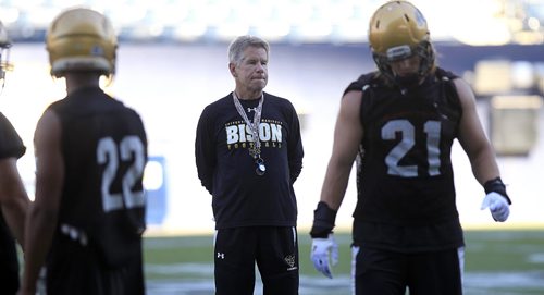 PHIL HOSSACK / WINNIPEG FREE PRESS - Bison head coach Brian Dobie casts a critical eye over the herd as they practice at Investors Group Field Tuesday afternoon. See Jason Bell story.  August 16, 2016
