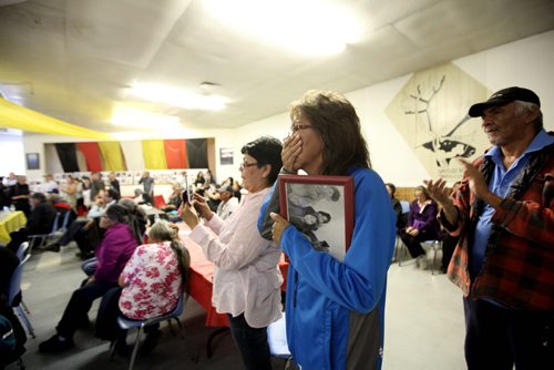 RUTH BONNEVILLE  / WINNIPEG FREE PRESS  Nancy Powderhorn of Tadoule Lake gets emotional while Minister Carolyn Bennett made a formal apology in Tadoule Lake on behalf of the Government of Canada for a forced relocation of Dene people.  She holds a picture of herself and family taken 60 years ago in Little Duck Lake before they were forced to leave.  


 See Alex Paul story.    Aug 16 / 2016