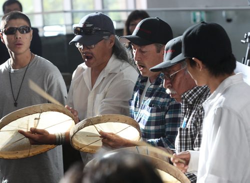 JOE BRYKSA / WINNIPEG FREE PRESS Chief Ernie Bussidor, center, with Dene drummers at ceremony to the Sayisi Dene people- Today at the Canadian Museum for Human Rights the Government of Canada apologized for the relocation of the Sayisi Dene from Little Duck Lake to North Knife River and Churchill in the 1950s and 1960s - Aug 17, 2016 -(  See Ashleys story)