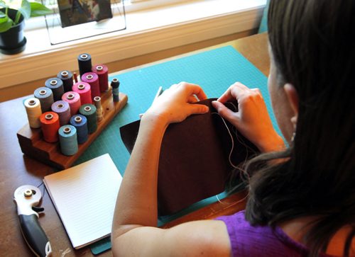 BORIS MINKEVICH / WINNIPEG FREE PRESS Andrea Davis has endometriosis which prevents her from working a regular 9-5 job. She started an Etsy company making hand-bound journals and notebooks that are ethically sourced. Her company is called We Are Bound Together. Detail shot of Davis working on a journal binding. For Erin Lebar story. August 17, 2016