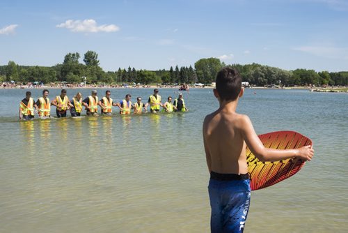 ZACHARY PRONG / WINNIPEG FREE PRESS  A boy watches as Beach Safety Officers search the waters at Birds Hill Park for a possible growing victim. August 17, 2016.