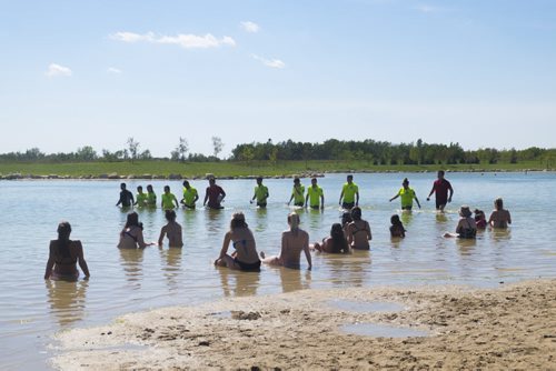 ZACHARY PRONG / WINNIPEG FREE PRESS  People watch as Beach Safety Officers search the waters at Birds Hill Park for a possible growing victim. August 17, 2016.