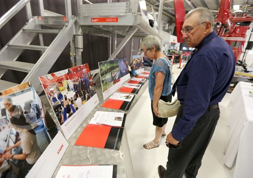 JASON HALSTEAD / WINNIPEG FREE PRESS  Steven Lipischak and wife Cecelia check out a display at a fundraising dinner for the Shock Trauma Air Rescue Society (STARS) on Aug. 17, 2016, at the STARS hangar. Steven was transported by STARS to Winnipeg from the Seven Sisters area after sustaining head trauma in a fall in September 2013. STARS is a non-profit helicopter air ambulance organization that provides rapid and specialized emergency care and transportation for critically ill and injured patients. (See Social Page)