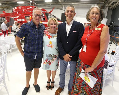 JASON HALSTEAD / WINNIPEG FREE PRESS  L-R: Event organizer and community advocate Louis Trepel, Shock Trauma Air Rescue Society (STARS) president and CEO Andrea Robertson, STARS transport physician Dr. Julian Regehr and Manitoba STARS Foundation executive director Els Fenton at a fundraising dinner for STARS on Aug. 17, 2016, at the STARS hangar. STARS is a non-profit helicopter air ambulance organization that provides rapid and specialized emergency care and transportation for critically ill and injured patients. (See Social Page)