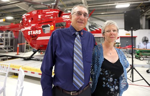 JASON HALSTEAD / WINNIPEG FREE PRESS  Steven Lipischak and wife Cecelia check out displays at a fundraising dinner for the Shock Trauma Air Rescue Society (STARS) on Aug. 17, 2016, at the STARS hangar. Steven was transported by STARS to Winnipeg from the Seven Sisters area after sustaining head trauma in a fall in September 2013. STARS is a non-profit helicopter air ambulance organization that provides rapid and specialized emergency care and transportation for critically ill and injured patients. (See Social Page)