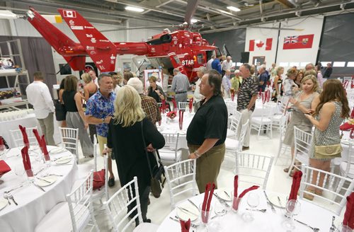 JASON HALSTEAD / WINNIPEG FREE PRESS  Guests at a fundraising dinner for the Shock Trauma Air Rescue Society (STARS) on Aug. 17, 2016, at the STARS hangar. STARS is a non-profit helicopter air ambulance organization that provides rapid and specialized emergency care and transportation for critically ill and injured patients. (See Social Page)