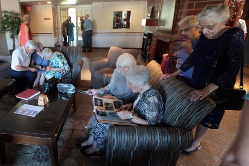 PHIL HOSSACK / WINNIPEG FREE PRESS -  Club 56 is a group of couples who all married in 1956. members browse phot albums before the group's 60th anniversary dinner. See Jen Zoratti story.  August 17, 2016