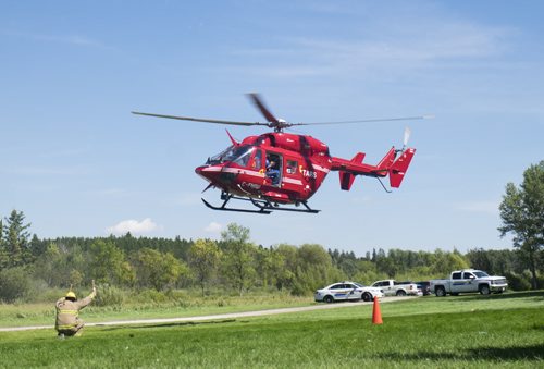 ZACHARY PRONG / WINNIPEG FREE PRESS  A helicopter takes off at Birds Hill Provincial Park after reports of a possible drowning. The helicopter left the scene after about an hour. August 17, 2016.
