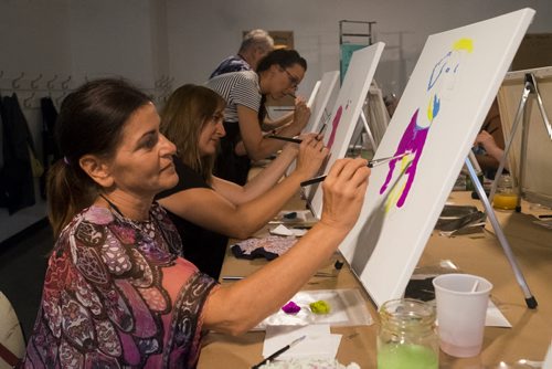 ZACHARY PRONG / WINNIPEG FREE PRE  Carla Monroe, left, and Sharon Walters work on their"Andy Warhol inspired" paintings during a class open to the public at the Winnipeg Art Gallery (WAG) Studio on August 18, 2016. Tickets to the event went to support the WAG Youth and Outreach Programs.