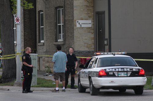 JOE BRYKSA / WINNIPEG FREE PRESS Winnipeg Police are guarding a scene of a beating on the outside of 448 Cumberland Friday morning -   - Aug 19, 2016 -(  Breaking News)