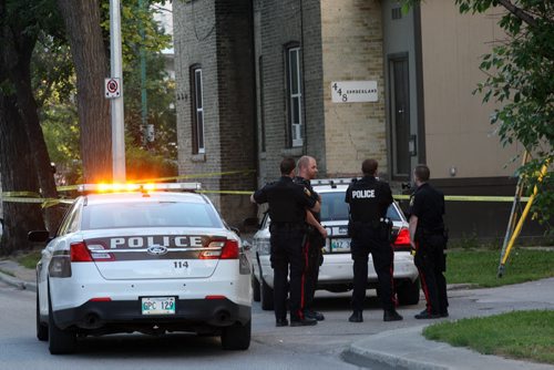 JOE BRYKSA / WINNIPEG FREE PRESS  Winnipeg Police are guarding a scene of suspicious death outside of 448 Cumberland Friday morning  Items on outside stairs at scene, including womens clothing  - Aug 19, 2016 -(  Breaking News)