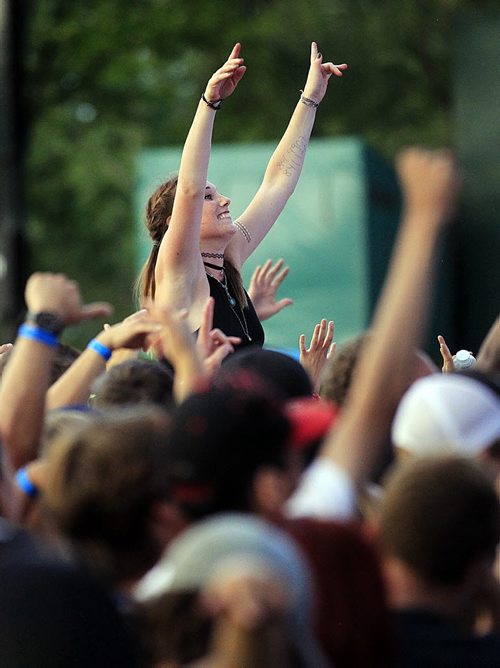 PHIL HOSSACK / WINNIPEG FREE PRESS - Electric Sunset - Dancers irave Friday evening at Shaw Park. STAND-UP See release?? August 19, 2016