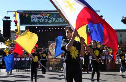 RUTH BONNEVILLE  / WINNIPEG FREE PRESS  Thirteen-year-old Ezra Cusimu performs with The Winnipeg Sikaran Arnis Academy, a martial arts school in front of the stage on Broadway at the  5th annual Manitoba Filipino Street Festival Saturday.    Aug 16 / 2016