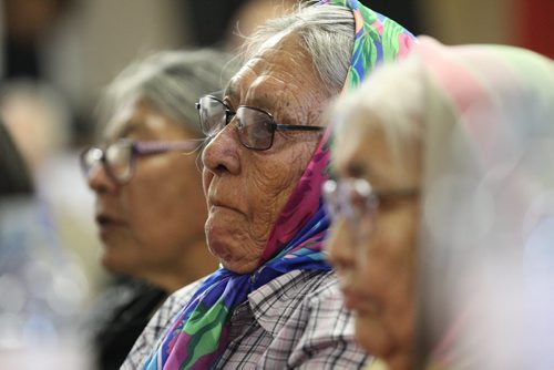 RUTH BONNEVILLE / WINNIPEG FREE PRESS   Some of the Sayisi Dene survivors that were forced to leave their home in Little Duck Lake 60 years ago by the government of Canada try to hold back tears as they listen intently to minister Carolyn Bennett make a formal apology to the residents of Tadoule Lake Tuesday.  Betty Solomon (in centre of group of women) is one of 18 survivors of 300 Dene residents  who had to leave their home.    See Alex Paul story.   Aug 16 / 2016