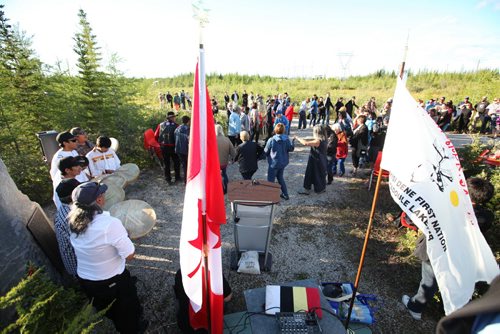 RUTH BONNEVILLE  / WINNIPEG FREE PRESS  Minister Carolyn Bennett (blond) dances in a circle with Dene people and others attending a formal ceremony in Dene Village near Churchill Manitoba Tuesday.  Minister Bennett  made a formal apology at Dene Village and in Tadoule Lake earlier on behalf of the Government of Canada for a forced relocation of Dene people. See Alex Paul story.    Aug 16 / 2016