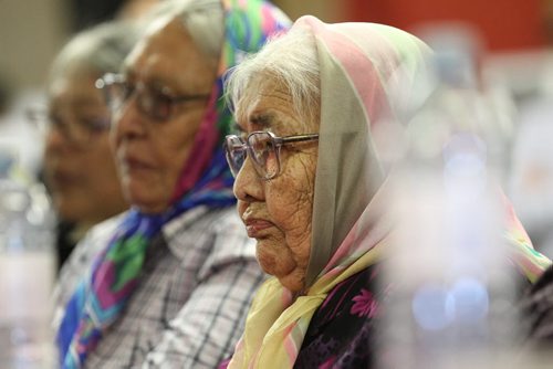 RUTH BONNEVILLE / WINNIPEG FREE PRESS   Some of the Sayisi Dene survivors that were forced to leave their home in Little Duck Lake 60 years ago by the government of Canada try to hold back tears as they listen intently to minister Carolyn Bennett make a formal apology to the residents of Tadoule Lake Tuesday.  Rubina Duck (front)  is one of 18 survivors of 300 Dene residents who had to leave their home.    See Alex Paul story.   Aug 16 / 2016