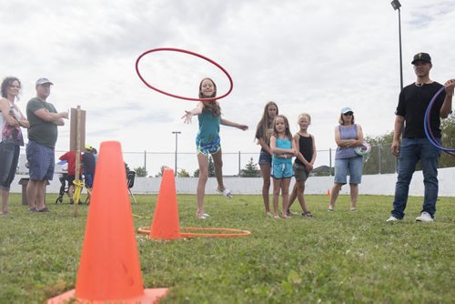 ZACHARY PRONG / WINNIPEG FREE PRESS  Kaylee McManus, 11, throws a hoop at the Whyte Ridge Summer Carnival on August 21, 2016. Dozens of families were in attendance to enjoy a variety of activities such as games and face painting. The carnival runs Saturday until 4:00 p.m.