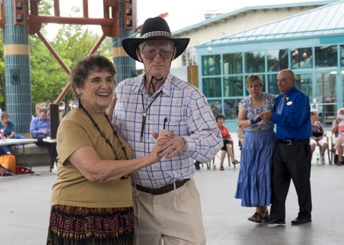 ZACHARY PRONG / WINNIPEG FREE PRESS  Sybil Gardiner and her husband Dave perform a round dance at The Forks on August 21, 2016. Members from several square dancing clubs in Winnipeg performed for passers by.